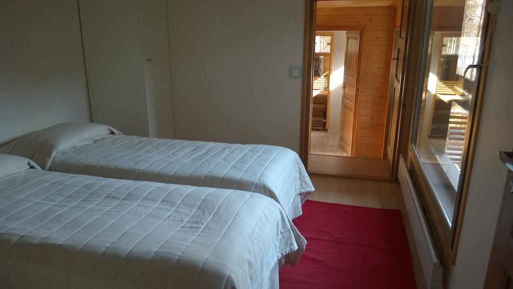 Kuoreksenniemi Villas & Lakehouse Puumala Oda fotoğraf